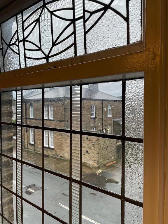 Looking out of window in to street in Saltaire