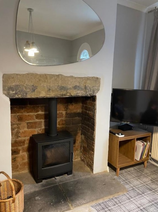 Fireplace with mirror above