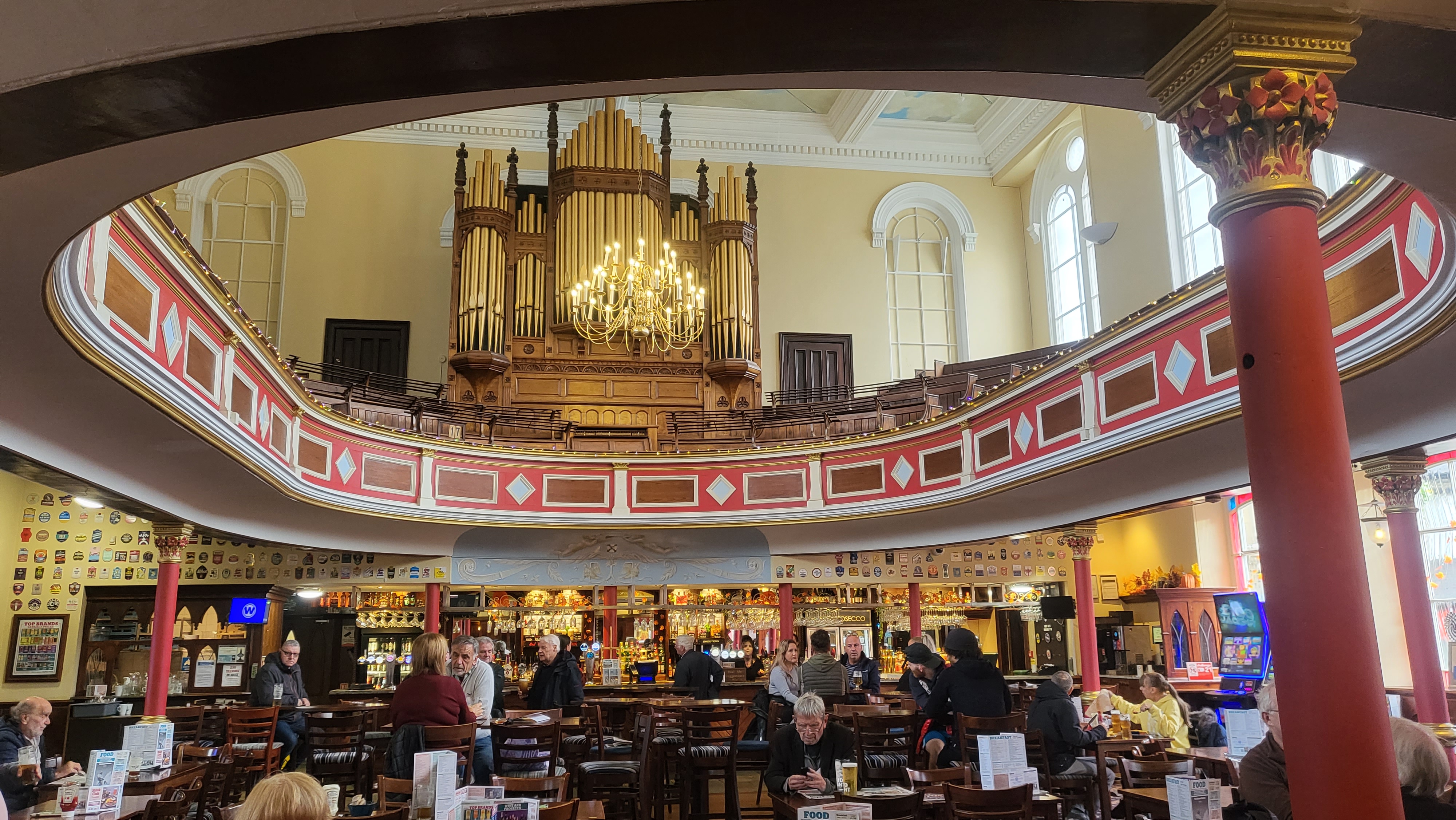 Interior of Brighouse Wetherspoons, showing balcony above bar and former chapel organ
