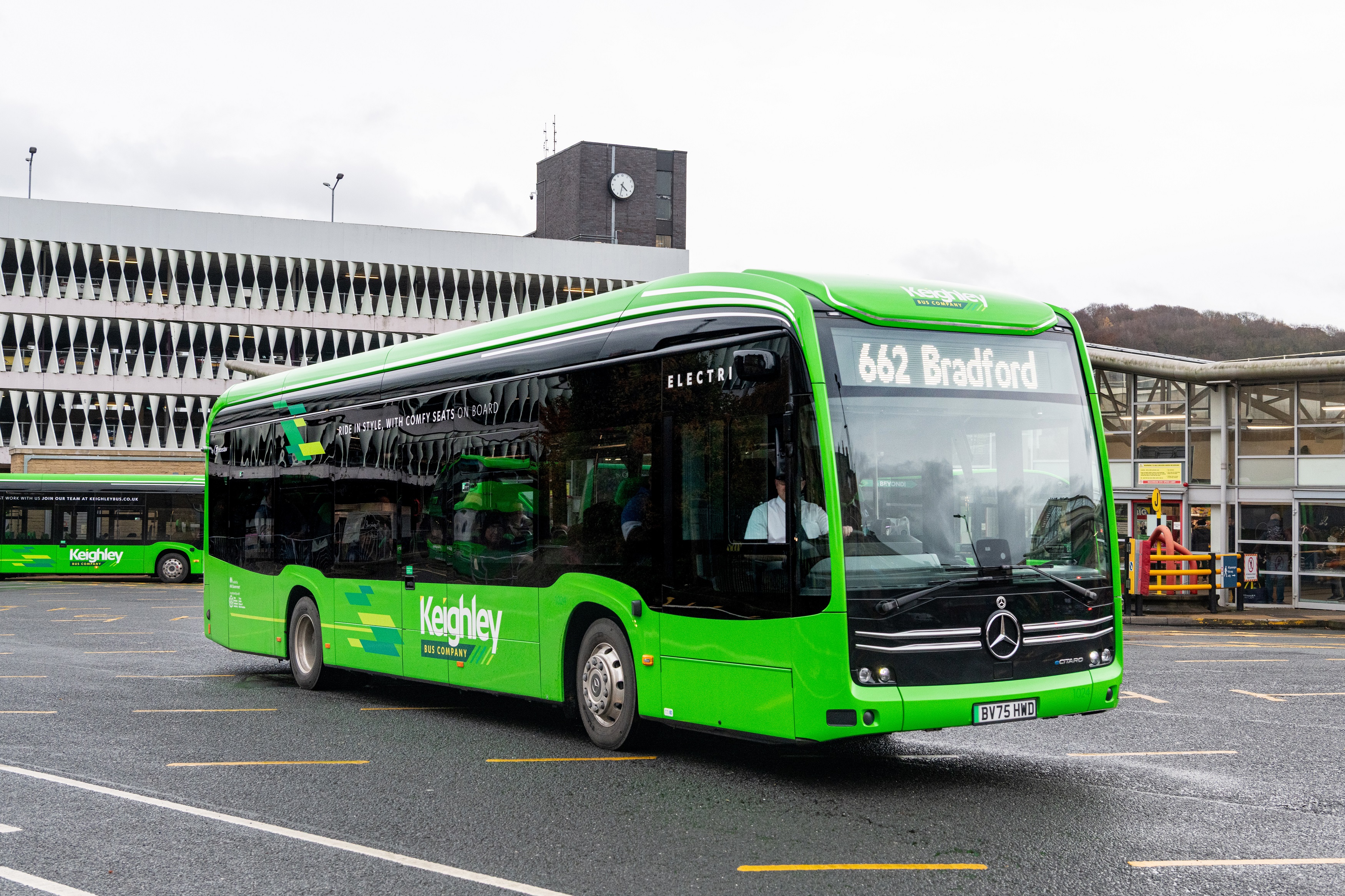 Green bus in bus station