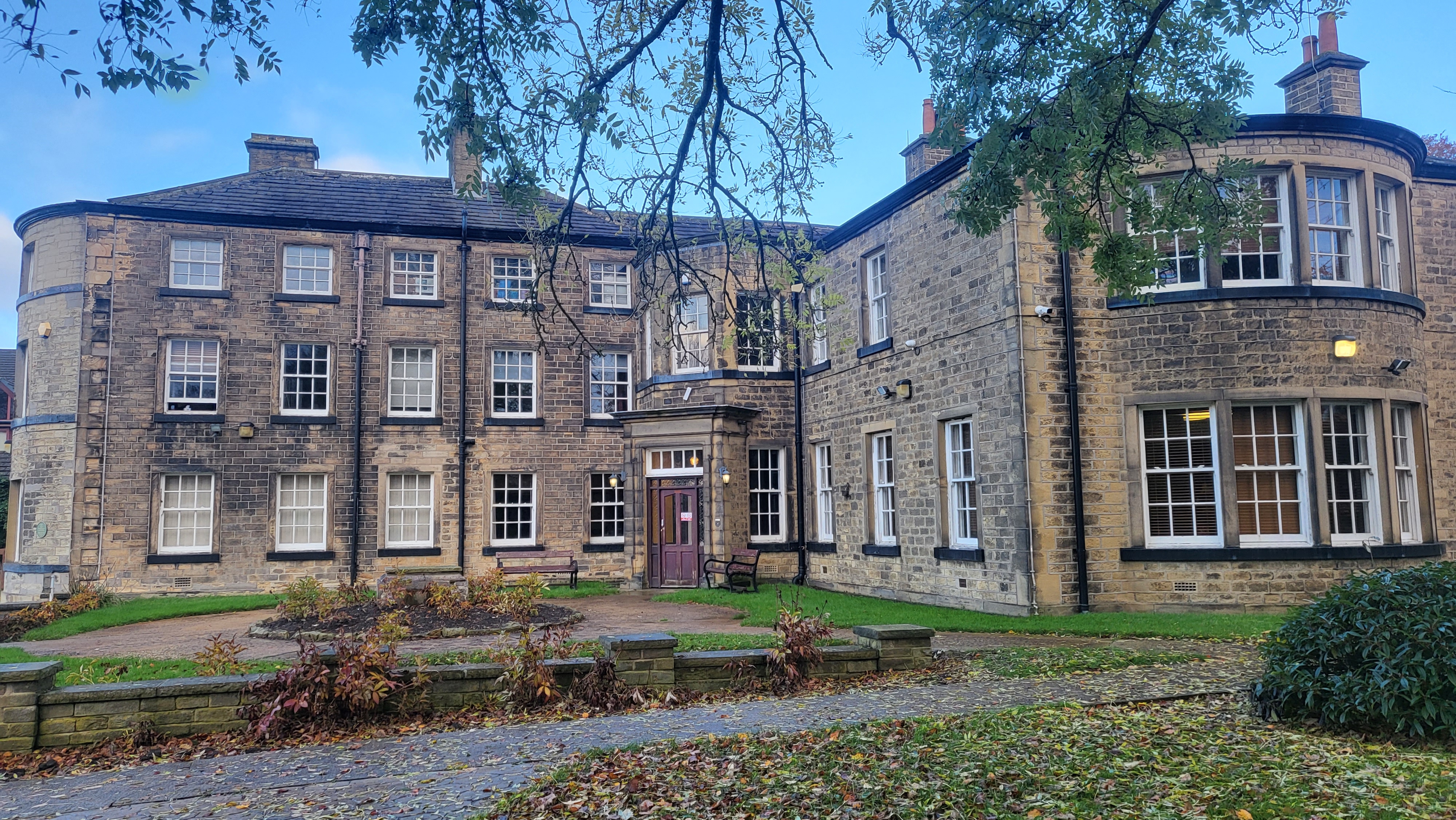 Frontage of Roe Head School, with stone bay windows