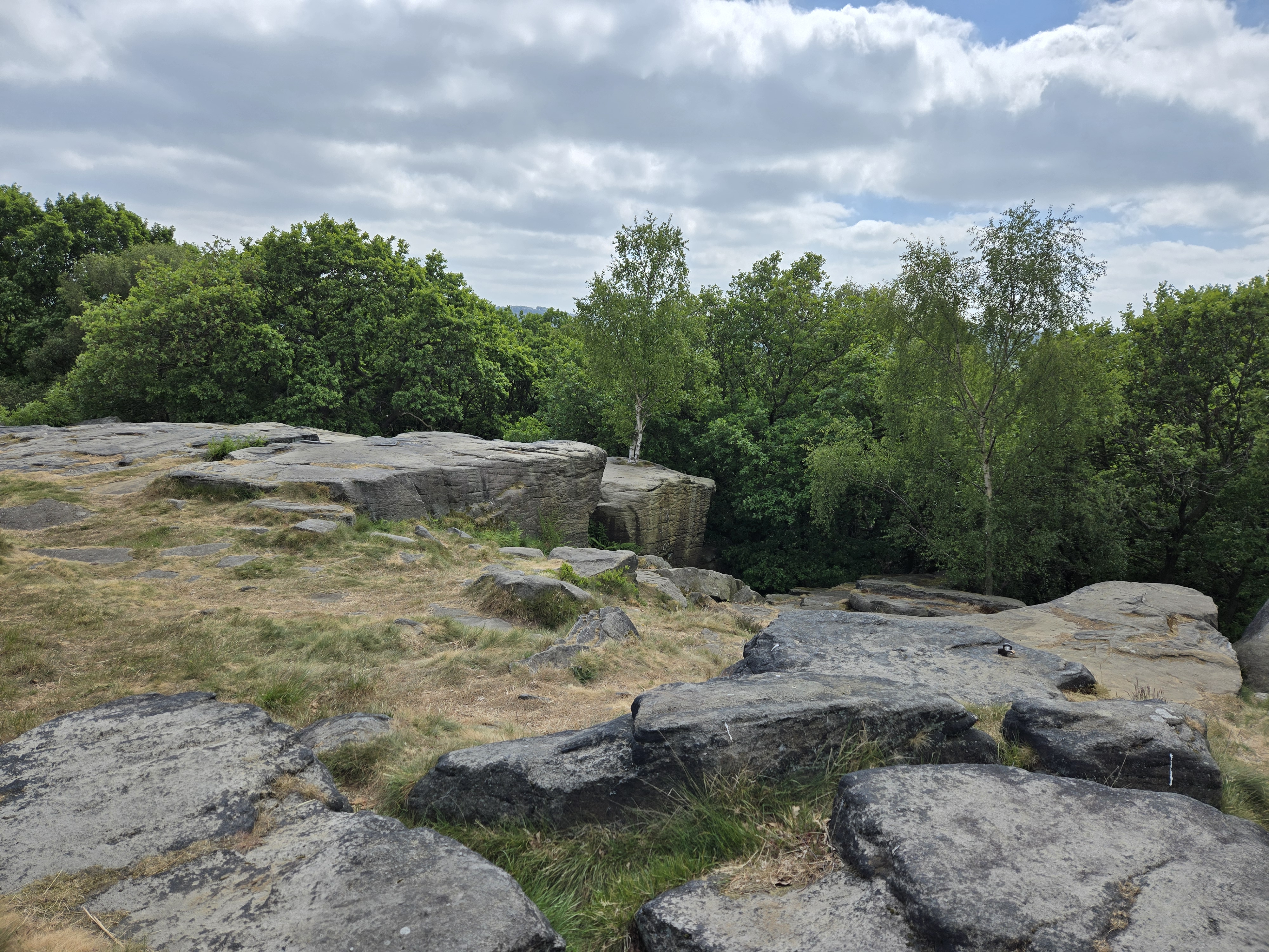 Rocky outcrops above wooded valley